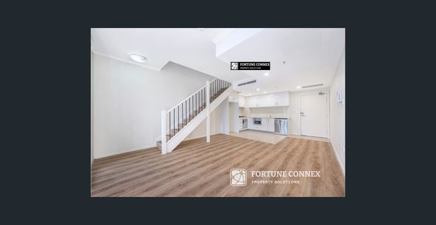 Stylish Dual-Level Apartment Steps from Transport & Amenities - Photo 1