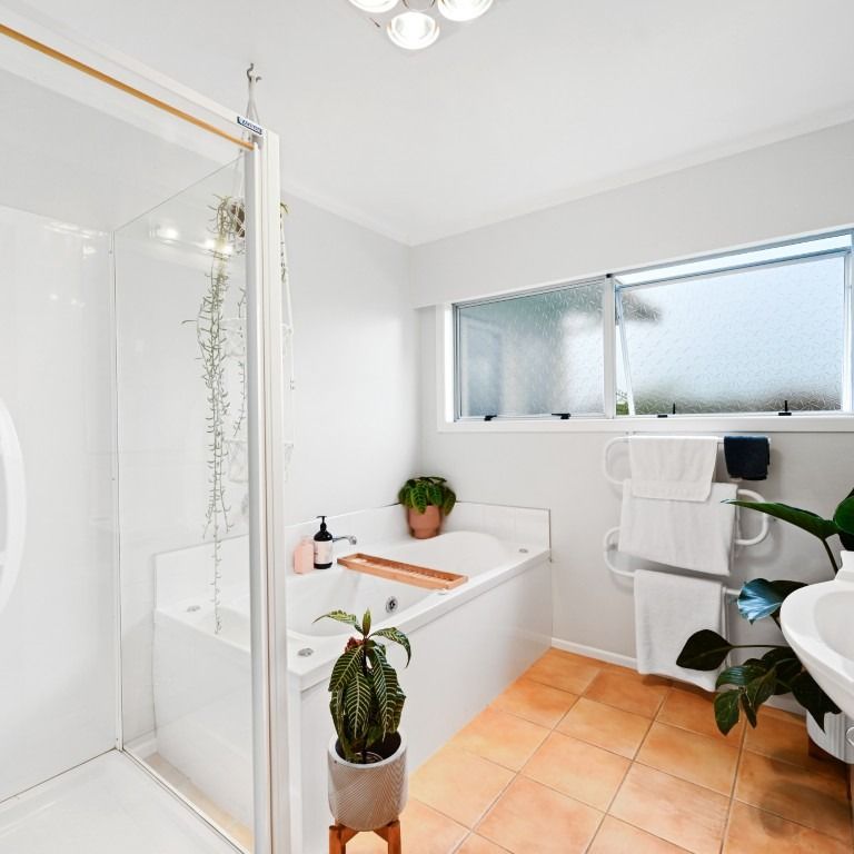 This modern four-bedroom, two-bathroom home offers the perfect blend of comfort and convenience. - Photo 1