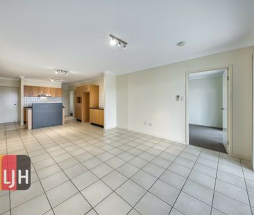 TOP FLOOR THREE BEDROOM UNIT WITH DOUBLE GARAGE & LARGE DECK! - Photo 3