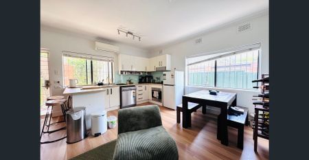 Partially Furnished Semi-Style Apartment with Private Courtyard - Photo 4