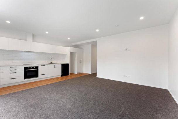 Enjoy modern living in a brand new unit - Photo 1