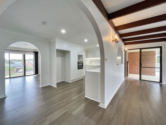 Renovated 3-Bedroom Home with Double Garage & Multiple Living Areas - Photo 1