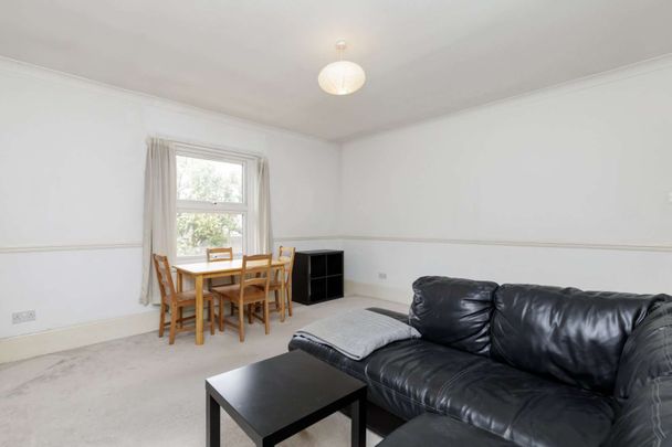 Attractive period conversion property with charm and character located on a popular, tree-lined street. - Photo 1