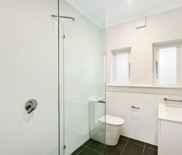 Charming Character Apartment with Sunroom & Garage - Photo 3