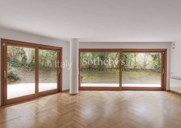 Apartment with garden and communal swimming pool