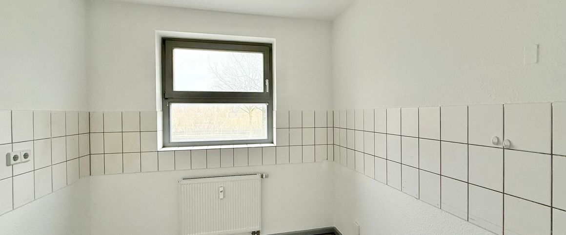 Schöne 3-Zimmer-Erdgeschosswohnung mit Balkon in zentrumsnaher Lage - Photo 1