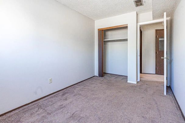 Renovated Forest Heights 4Plex 2 Bed 1.5 Bath Unit with Fireplace! — #2, 1419 43 Street SE - Photo 1