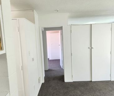 A two-bedroom, one-bathroom unit offering a generous open-plan livi... - Photo 6