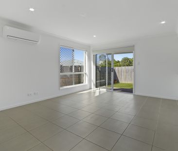 Spacious 4-Bedroom Duplex with Modern Comforts - Photo 1