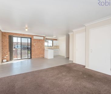 Spacious townhouse with parking for two vehicles. - Photo 2