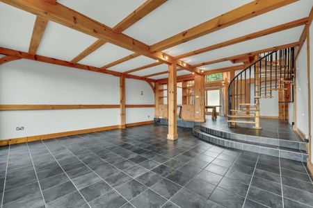 Hanger Lodge occupies an enviable setting, down a quiet country lane in Churt, close to Frensham Great Pond. - Photo 3