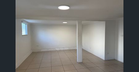 Spacious Queenslander with Big Backyard and Dual Living Option - Photo 2