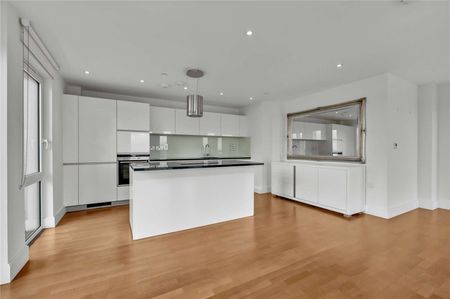 Situated on the eleventh floor, the property enjoys the benefit of a private balcony as well as access to the communal grounds of the development which overlook the river and Canbury Gardens - Photo 5