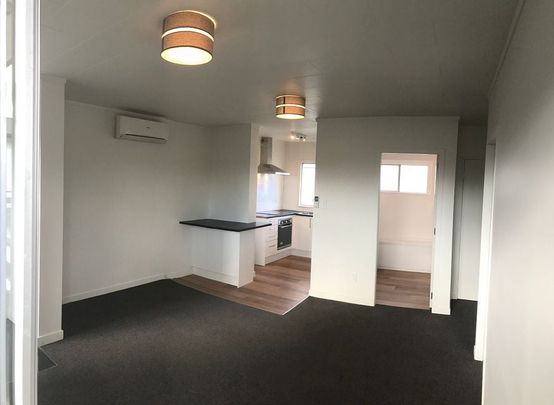 Bright Upstairs Two-Bedroom Unit – Handy Location - Photo 1