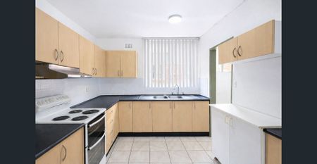 WELL-PRESENTED 2-BEDROOM UNIT IN A GOOD CABRAMATTA LOCATION - Photo 3