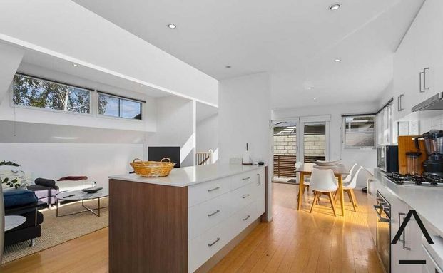 Stylish and Spacious Furnished Home with Private Garden and Modern Features - Photo 1