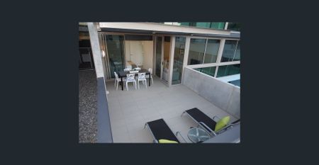 Enjoy the lifestyle this quality 1 bedroom furnished apartment can deliver with a large, covered outdoor living area and new hybrid floors throughout! - Photo 5