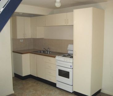 CHARMING 1-BEDROOM LOFT-STYLE UNIT IN A CONVENIENT LOCATION - Photo 1