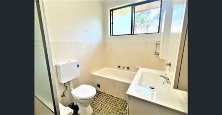 Spacious Top-Floor Unit in Prime Location - Photo 2