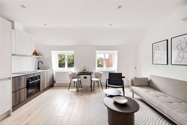 An impeccably designed top floor, 1 bedroom apartment with ample storage. - Photo 1