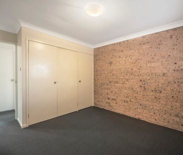 Comfortable Two-Bedroom Unit in Convenient Location - Photo 3
