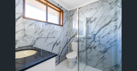 Spacious Family Living with Multiple Living Zones and Stunning Renovated Bathrooms - Photo 5