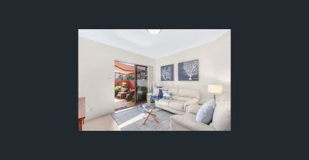 Spacious and stylish, this three-bedroom home offers modern comfort and an unbeatable location just minutes from the coast. - Photo 2