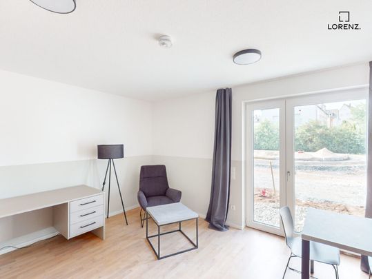 Möbliertes 1-Zimmer-Apartment mit Terrasse im Erstbezug! - Photo 1