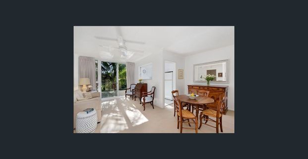 Private and beautifully renovated apartment with undercover security parking - Photo 1