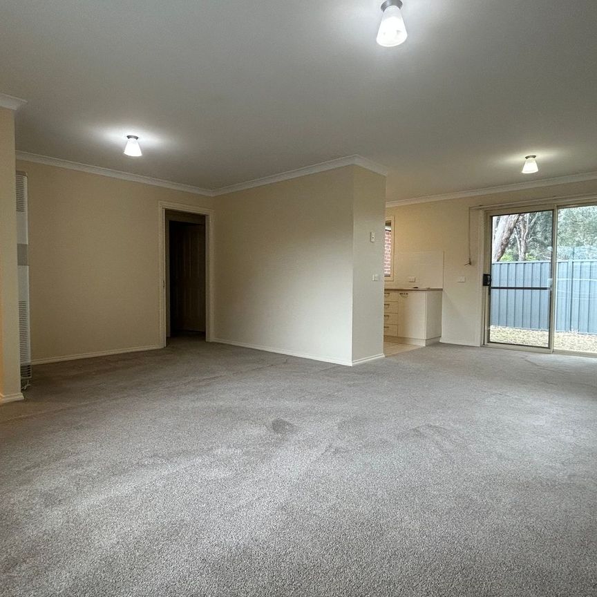 COMFORTABLE TWO-BEDROOM TOWNHOUSE IN A CONVENIENT LOCATION - Photo 1