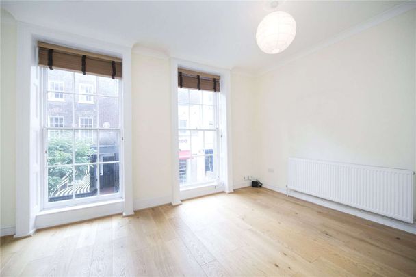 A spacious two bedroom split level flat on Exmouth Market - Photo 1