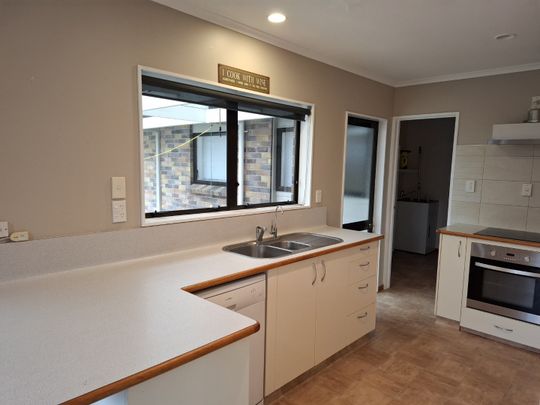 This fantastic family home offers a generous open-plan living on the ground floor, seamlessly flowing out to a rear patio and fully fenced yard—perfect for entertaining or relaxing with family. - Photo 1