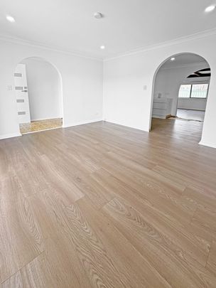 Renovated 3-Bedroom Home with Double Garage & Multiple Living Areas - Photo 1