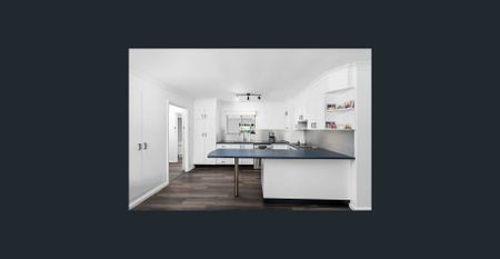 Family home with multiple living zones and large fenced yard - Photo 3