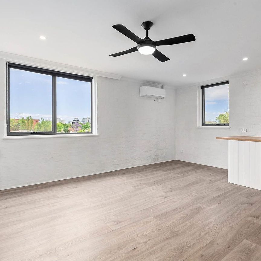 Light-Filled Top-Floor Sanctuary with Sweeping Views and Exceptional Space - Photo 1