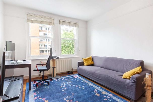 A modern top floor, two bedroom apartment in a well maintained terraced building. - Photo 1