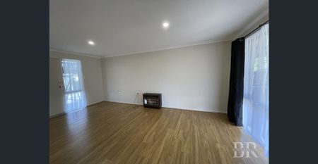 Refreshed Family Home with Spacious Yard and Powered Shed - Photo 2