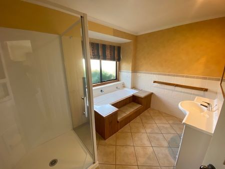 This appealing, sun-filled home features a bright open-plan kitchen and dining area, creating a welcoming space for everyday living. - Photo 4