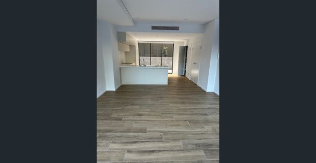 Near new, split level, spacious two bedroom, two bathroom apartment in quiet location only metres from Homebush Train Station - Photo 1