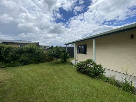 This tidy two-bedroom, one-bathroom home in Enderley offers comfortable living with an open-plan kitchen and lounge, and an internal laundry. - Photo 3