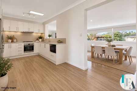 Modern Comfort Meets Family Living in a Light-Filled Home - Photo 4