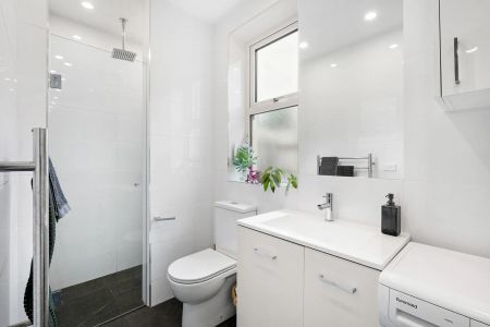 Renovated Beachside Pad with Art Deco Flair - Photo 4