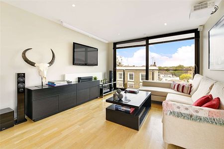 Three-bedroom apartment with wooden floors throughout and access to a private balcony and roof terrace in a modern development in SW10 - Photo 4