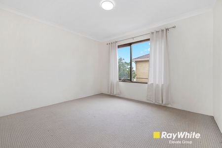 Charming Two-Bedroom Unit in an Ultra-Convenient Setting - Photo 2