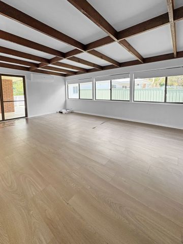 Renovated 3-Bedroom Home with Double Garage & Multiple Living Areas - Photo 2