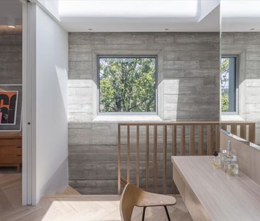 Introducing a remarkable dwelling nestled within a serene woodland enclave, the epitome of contemporary architecture. - Photo 3