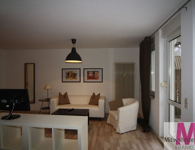 Schön möblierte 1-Zimmer-Wohnung mit kleiner Terasse - Foto 1