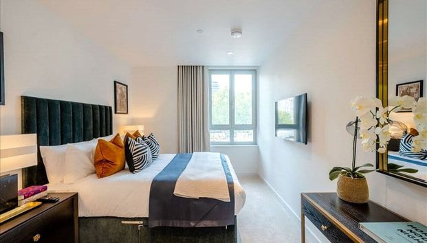 A luxurious interior designed one-bedroom 3rd floor apartment set over 542 SqFt comprising a large open-plan reception room leading onto a private inset balcony. EPC rating B | Council Tax Band E - Photo 1