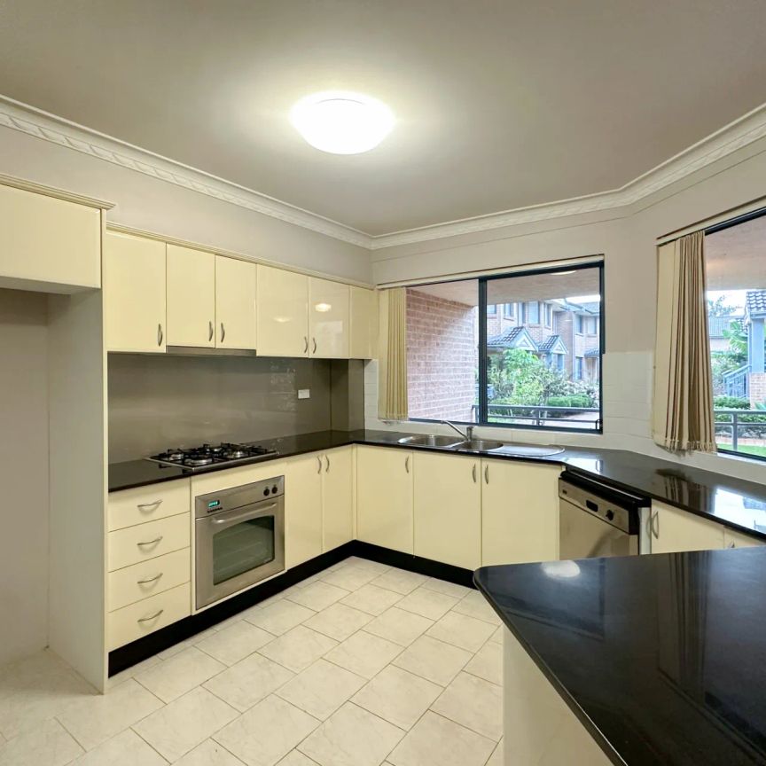 Oversized Two Bedroom Unit in Highly Convenient Locale - Photo 1