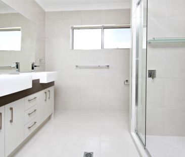 Executive Waterfront Living with Pool in Sought-After Twin Waters! - Photo 1